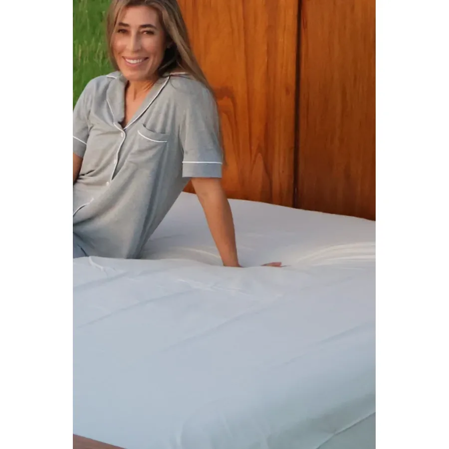The GroundLuxe fitted grounding sheet on a mattress