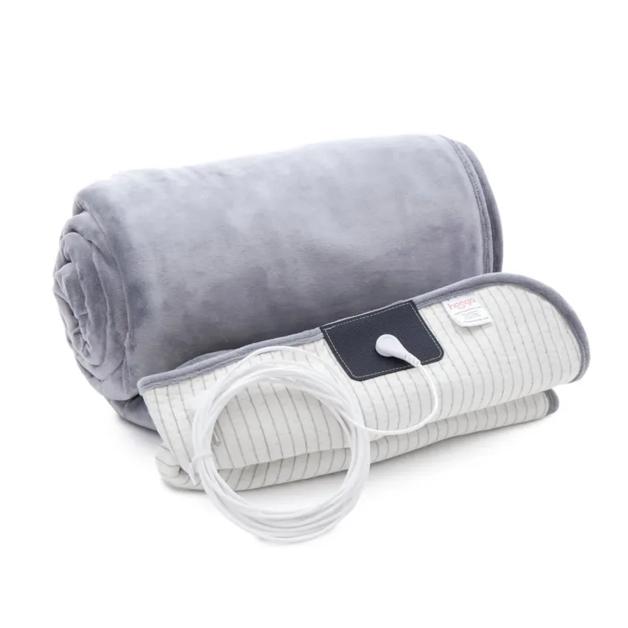 The Hooga grounding throw blanket rolled up with its grounding cord